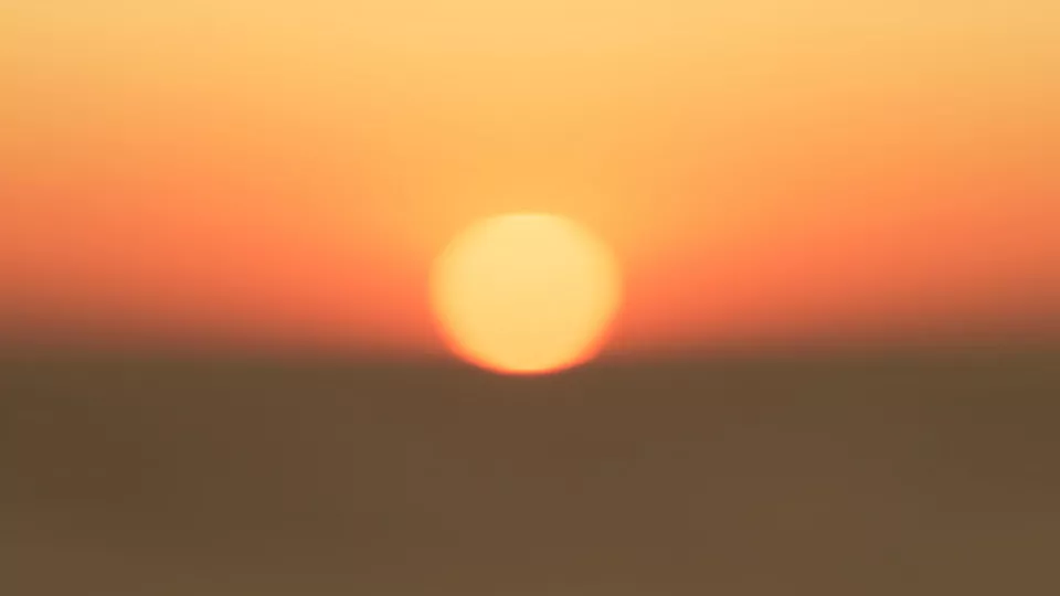 Sun in orange sky. genre image. By Jeremy Benzanger, on unsplash.